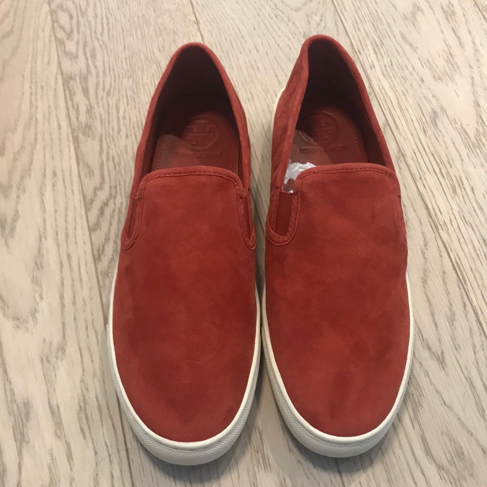Red slip on sneakers